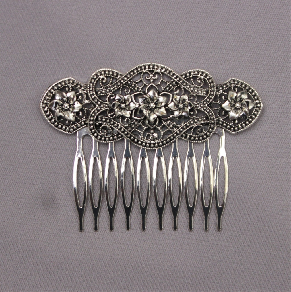[PTA00706076] Peineta metal plateada 5 flores
